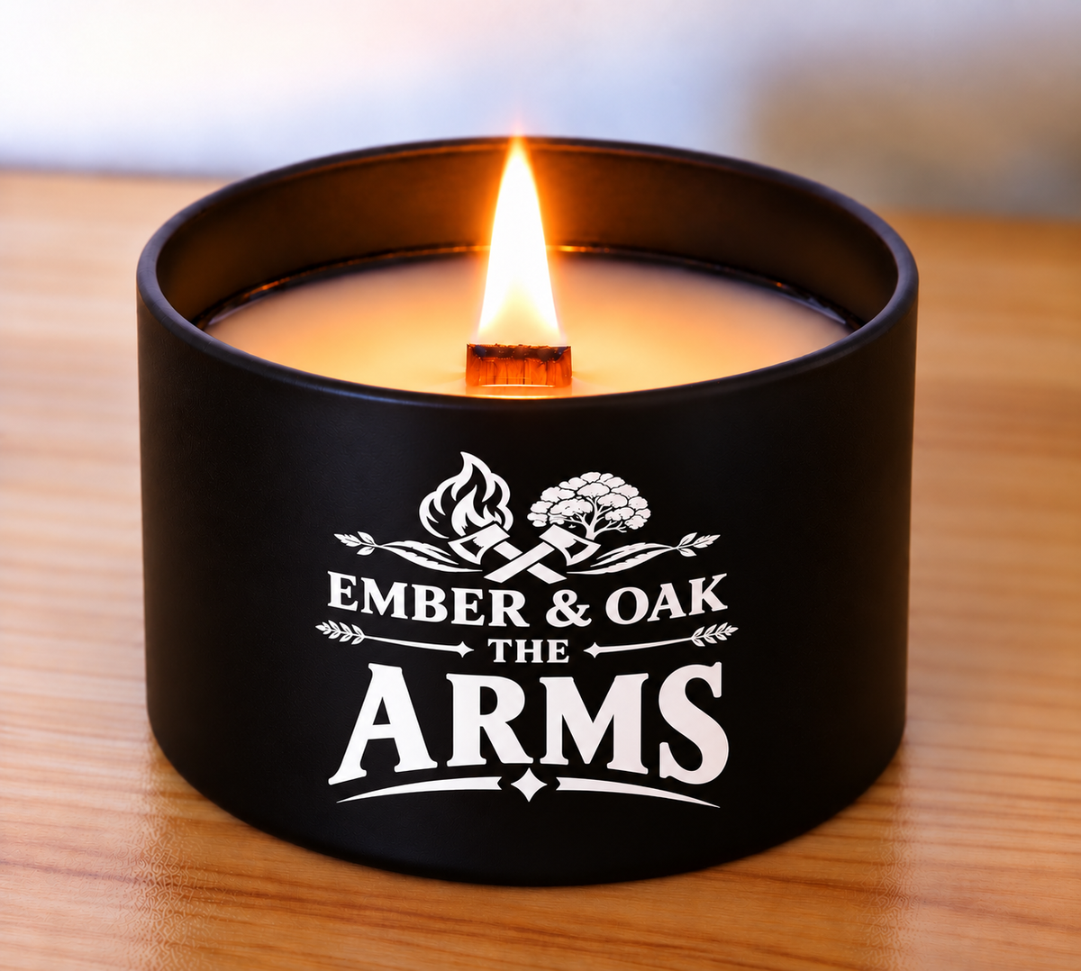The Arms 8oz luxury scented candle burning with wooden wick and Ember & Oak branding