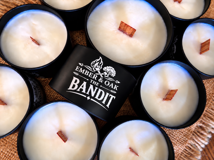     The Bandit luxury candle surrounded by multiple Ember & Oak candles
