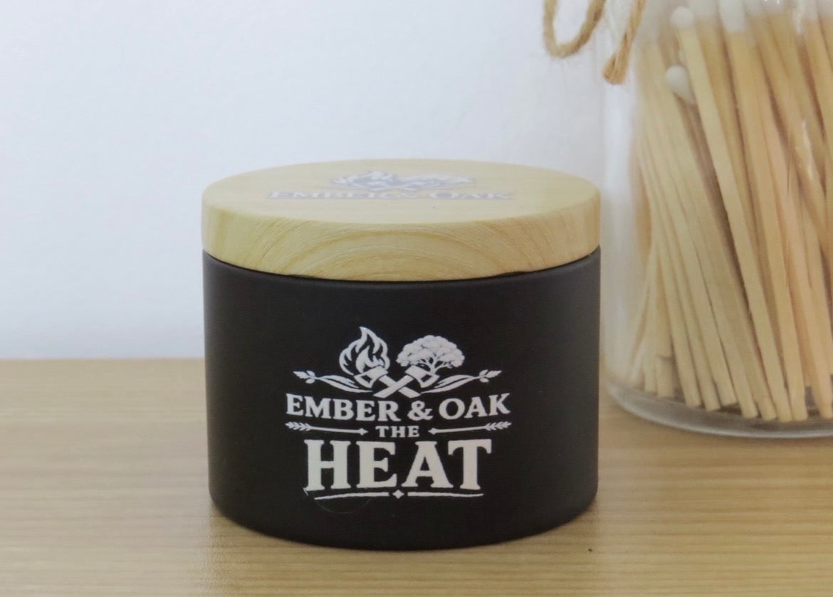     The Heat 8oz luxury scented candle with wooden lid and Ember & Oak branding