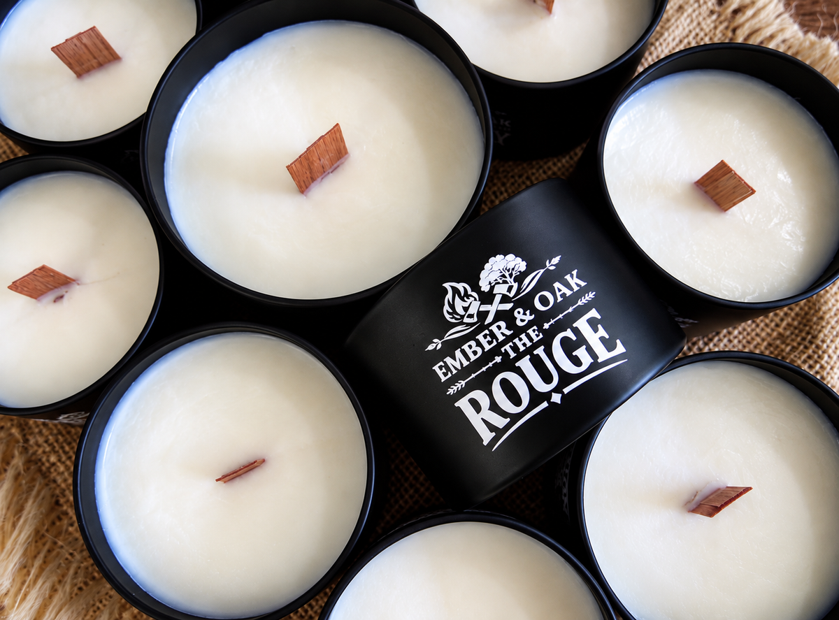     The Rouge luxury candle surrounded by multiple Ember & Oak candles