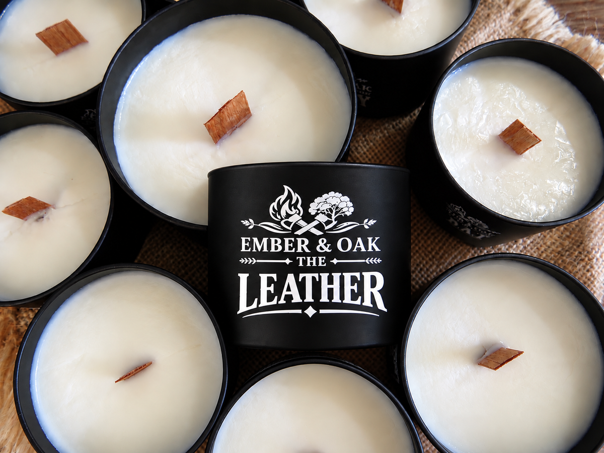 The Leather luxury candle surrounded by multiple Ember & Oak candles