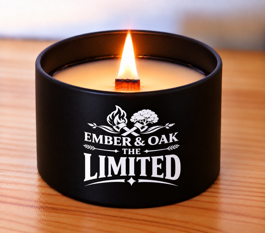     The Limited 8oz luxury scented candle burning with wooden wick and Ember & Oak branding