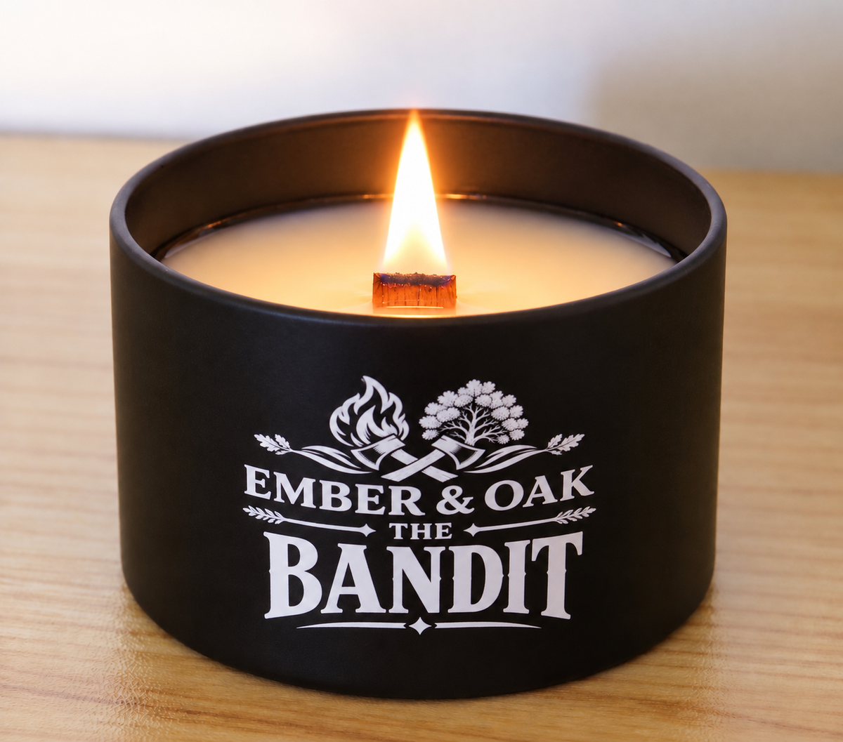     The Bandit 8oz luxury scented candle burning with wooden wick and Ember & Oak branding
