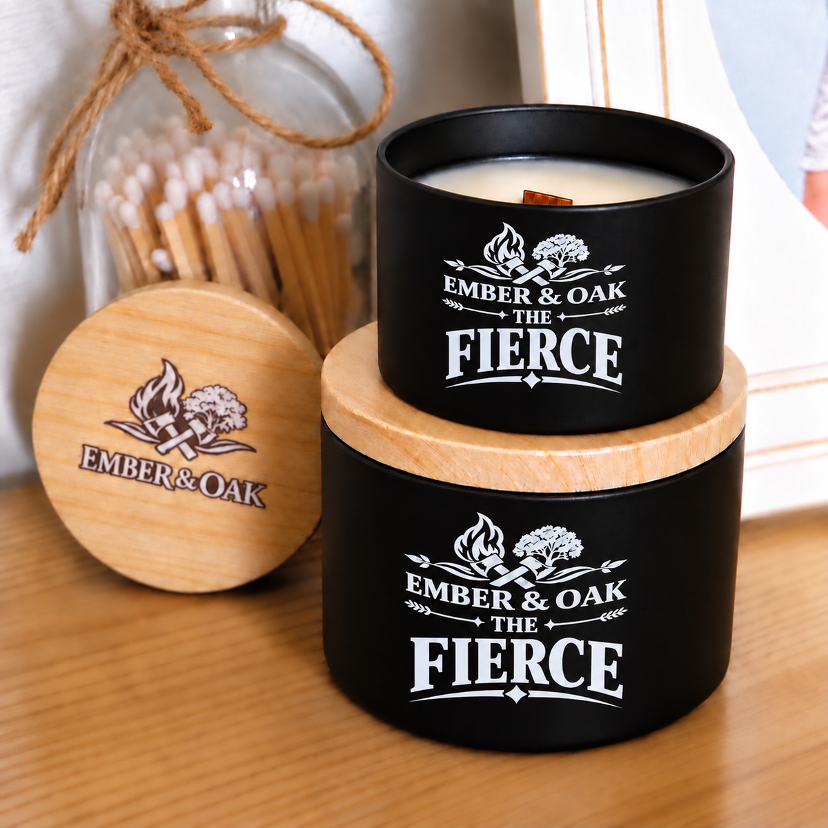     The Fierce luxury candle with wooden lid displayed alongside Ember & Oak packaging and accessories