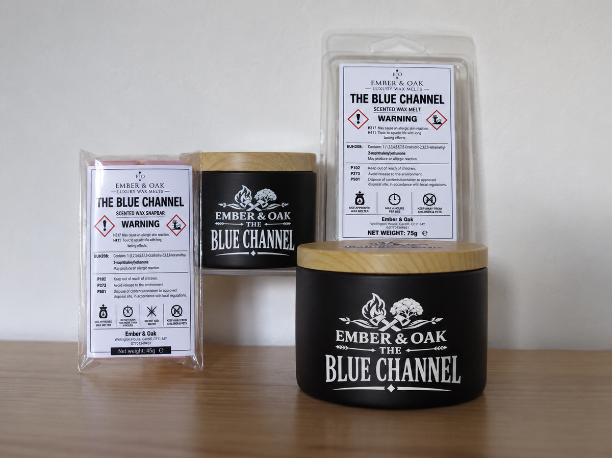     The Blue Channel candle, wax melt and snap bar displayed together with Ember & Oak packaging