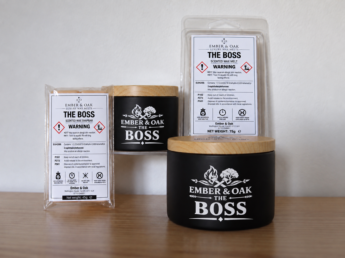     The Boss candle, wax melt and snap bar displayed together with Ember & Oak packaging