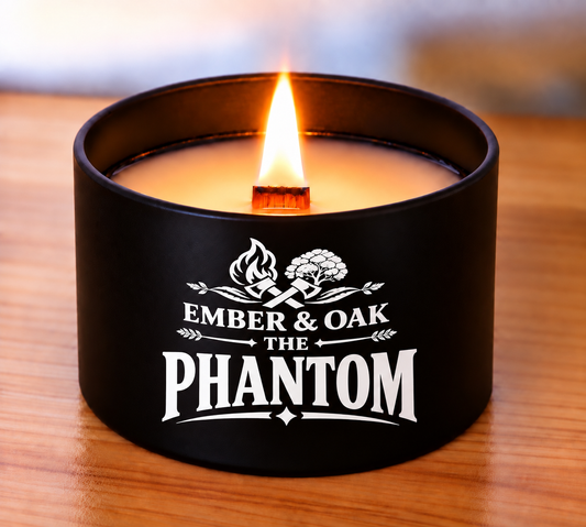     The Phantom 8oz luxury scented candle burning with wooden wick and Ember & Oak branding