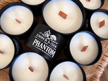     The Phantom luxury candle surrounded by multiple Ember & Oak candles