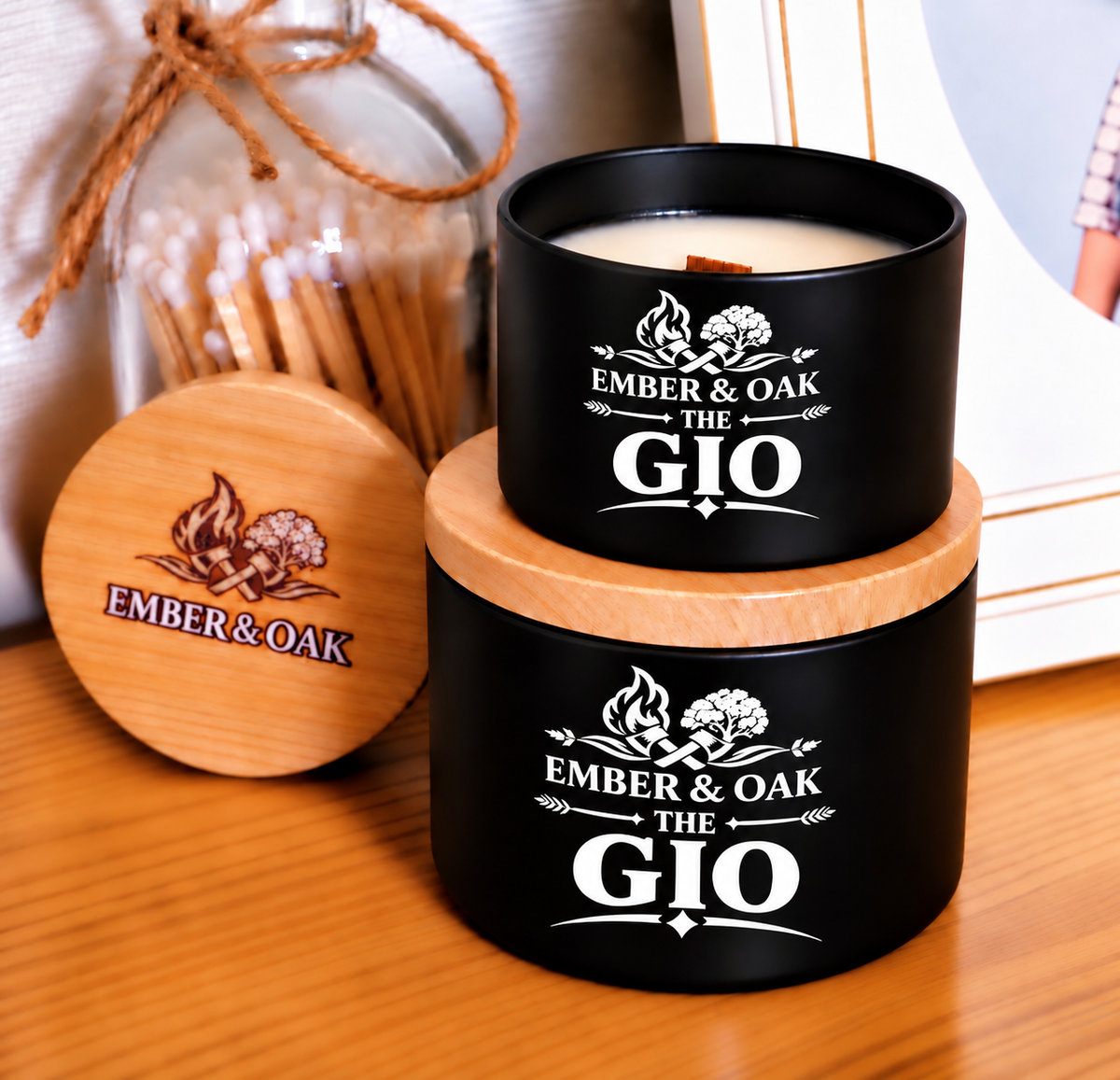 The Gio 8oz & 4oz candle with wooden lid displayed alongside Ember & Oak packaging