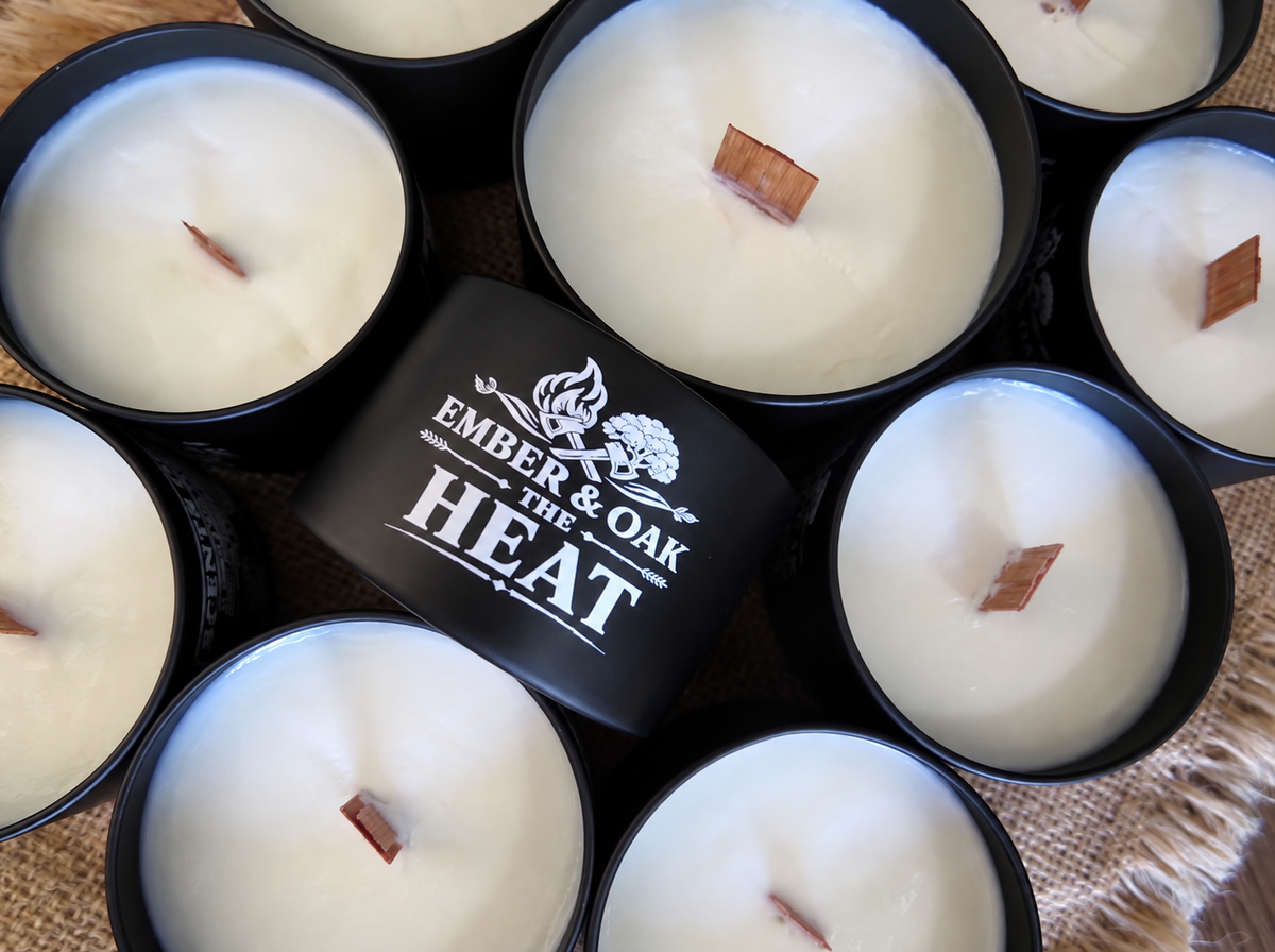     The Heat luxury candle surrounded by multiple Ember & Oak candles