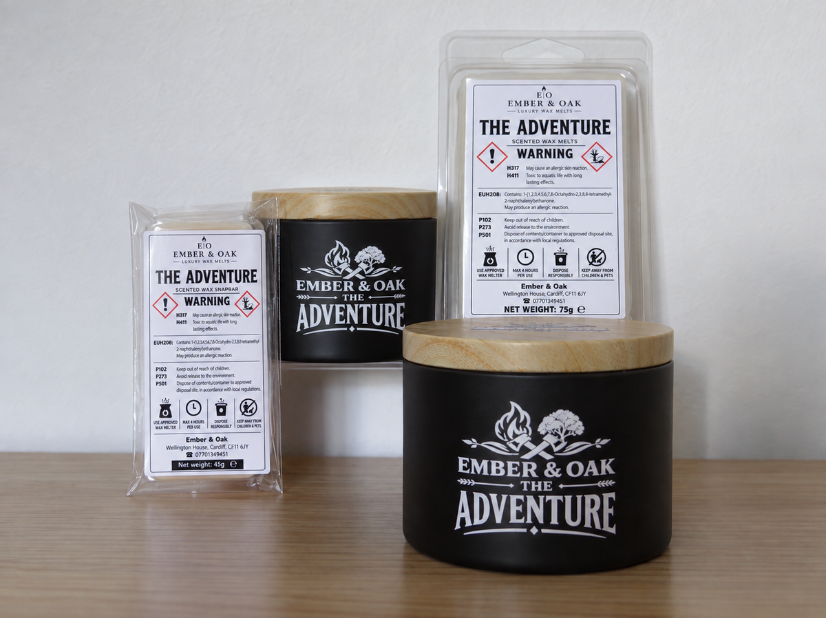 The Adventure candle, wax melt and snap bar displayed together with Ember & Oak packaging