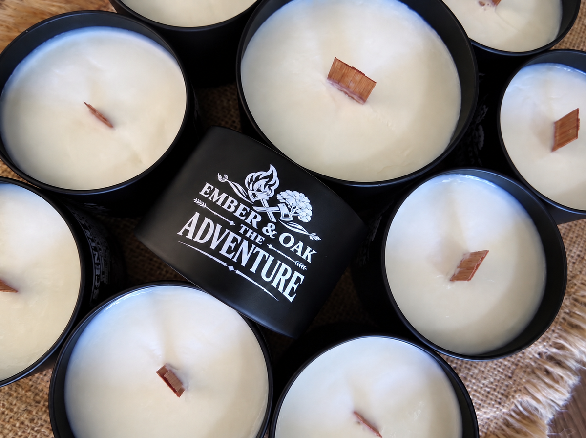 The Adventure luxury candle surrounded by multiple Ember & Oak candles